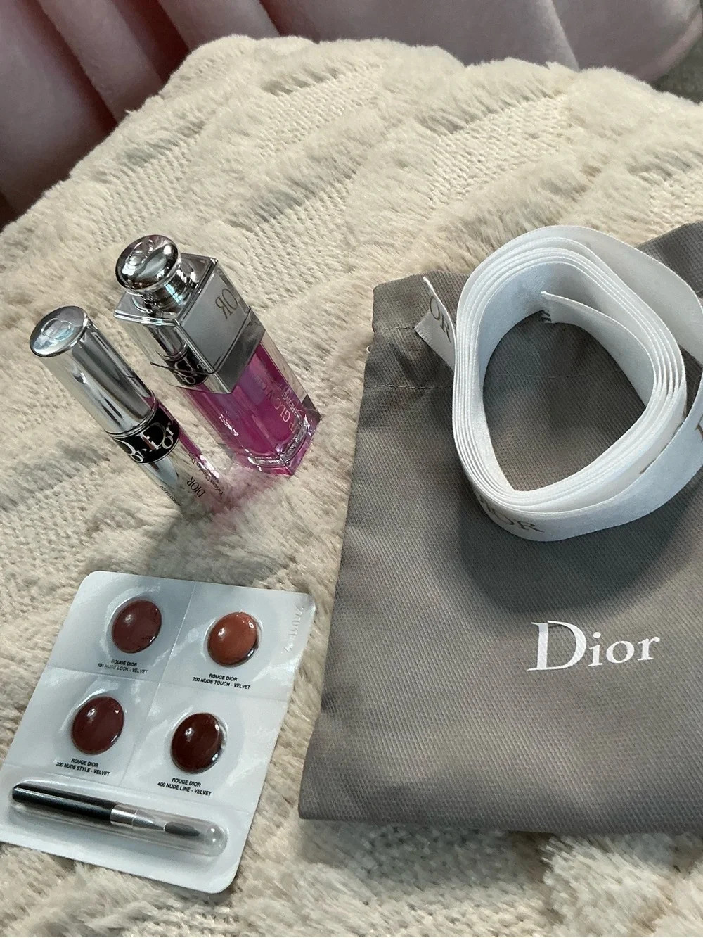 Dior White Logo Ribbon with Gray Pouch and Pink Lip Gloss Accent